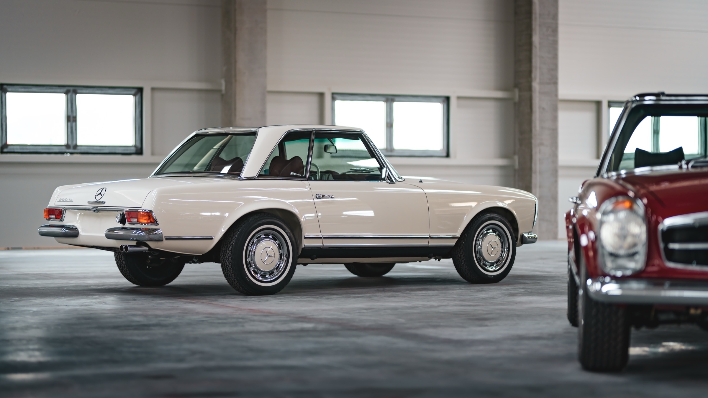 Cream Pagoda with its hardtop, rear three-quarter view in the hall